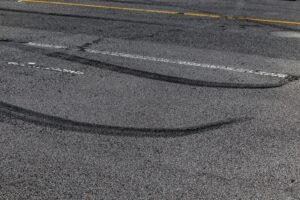 Skid marks appear on the road after a car accident. How is fault determined in a car accident?