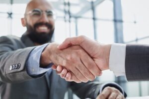 A Waterbury medical malpractice lawyer shakes hands with a client.