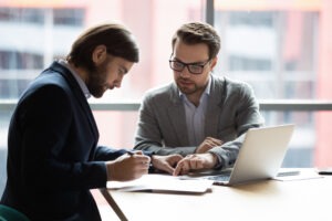 A wrongful death lawyer in Hartford, CT, reviewing legal options with a client who has lost a loved one.