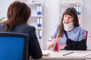 Catastrophic injury victim meets with a lawyer to file a claim.