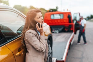 Woman calls Glastonbury lawyer as car is towed away from truck accident