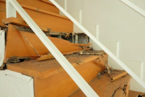 A set of badly damaged stairs that could cause an accident. After an injury, you can contact an Enfield premises liability lawyer.