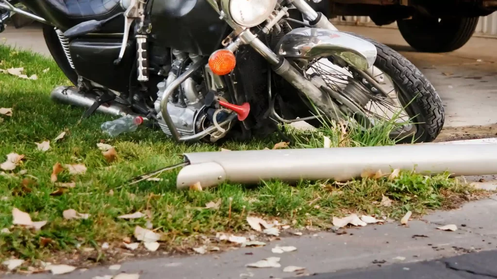 Damaged motorcycle on the ground after accident