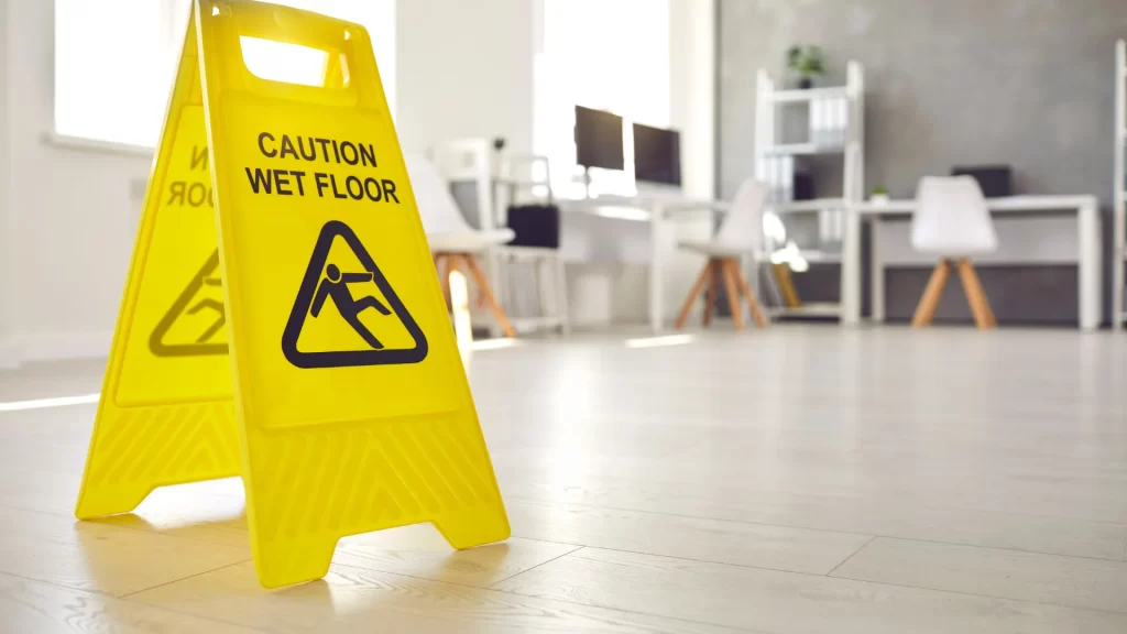 Yellow caution wet floor sign in office space